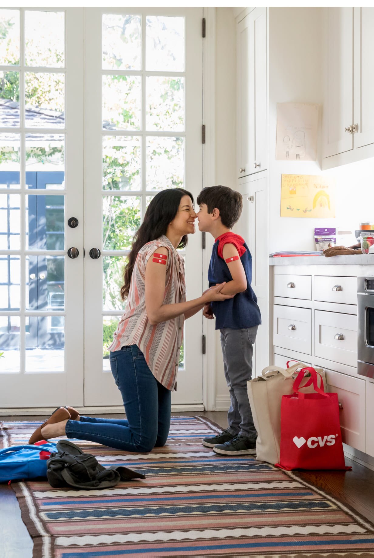 A mom shows how proud she is of her son for going to get vaccinated with her.