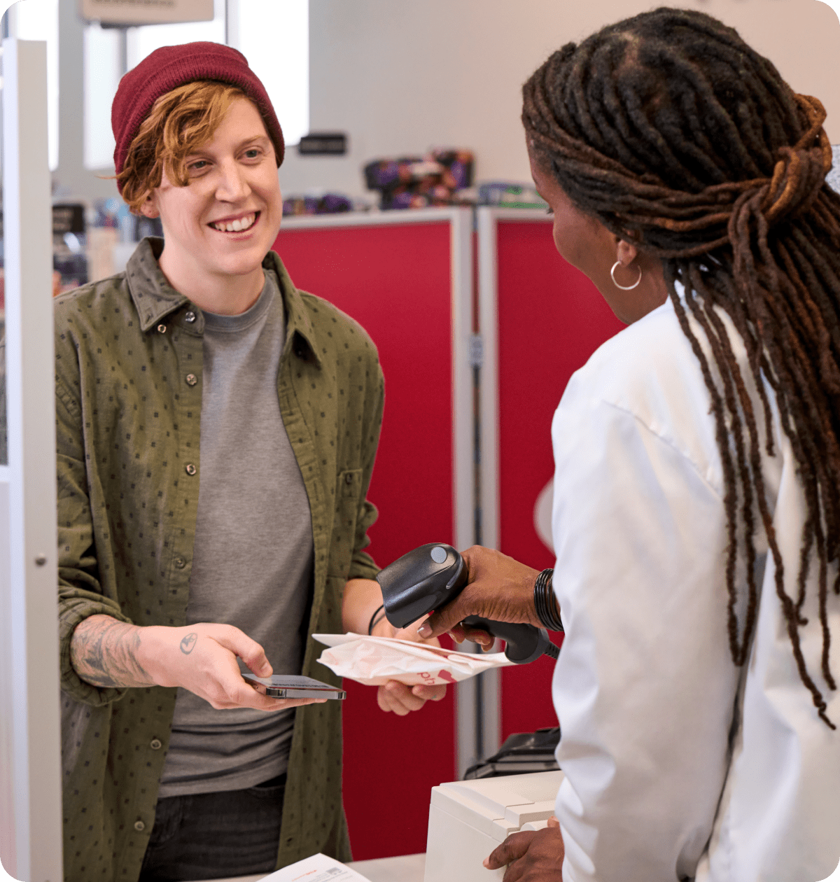 Pharmacist and patient interacting.
